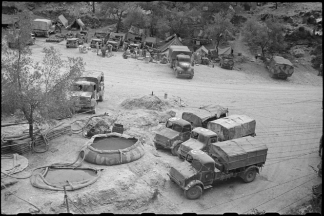 <p class='eng'>Elevated view of the water point at Hove Dump, Italy, a supply point for troops in the forward areas about Cassino, during World War II. Photograph taken on 29 April 1944 by George Robert Bull.<br /><br />Bull, George Robert, 1910-1996. Water point at Hove Dump, Cassino area, Italy, World War II - Photograph taken by George Bull. New Zealand. Department of Internal Affairs. War History Branch :Photographs relating to World War 1914-1918, World War 1939-1945, occupation of Japan, Korean War, and Malayan Emergency. Ref: DA-05621-F. Alexander Turnbull Library, Wellington, New Zealand. http://natlib.govt.nz/records/23061806</p>